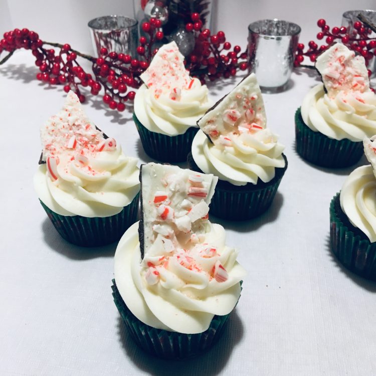 Peppermint Bark Cupcakes (chocolate cupcake, white mint frosting, topped with crushed candy canes and a piece of peppermint bark)