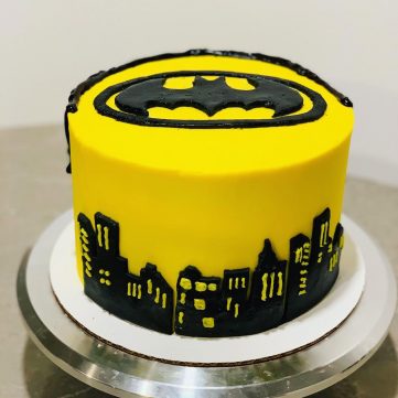 Batman Birthday Cake (topped with fondant Batman logo, decorated with black city skyline)