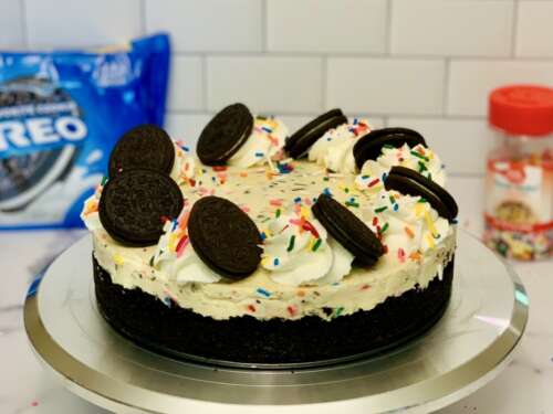 No-Bake Oreo Confetti Cheesecake No-Bake Oreo Confetti Cheesecake, Oreo crust decorated with whipped cream swirls and Oreo cookies