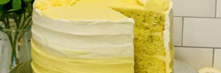 Lemon Poppyseed Sourdough Discard cake - thumbnail image w slice cut from cake to show 3 yellow lemon poppyseed layers inside