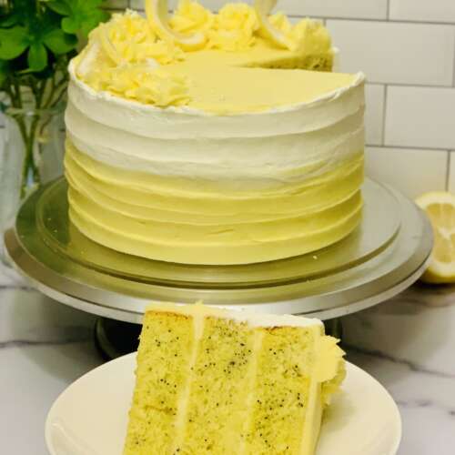 Lemon Poppyseed Sourdough Discard cake photo: slice cut from cake in foreground with remainder of cake in background